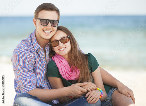 Portrait of young man and woman on a beach