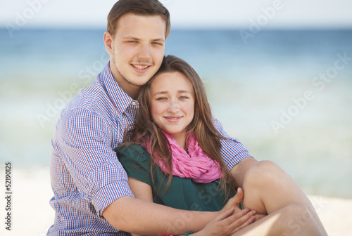 Portrait of young man and woman on a beach