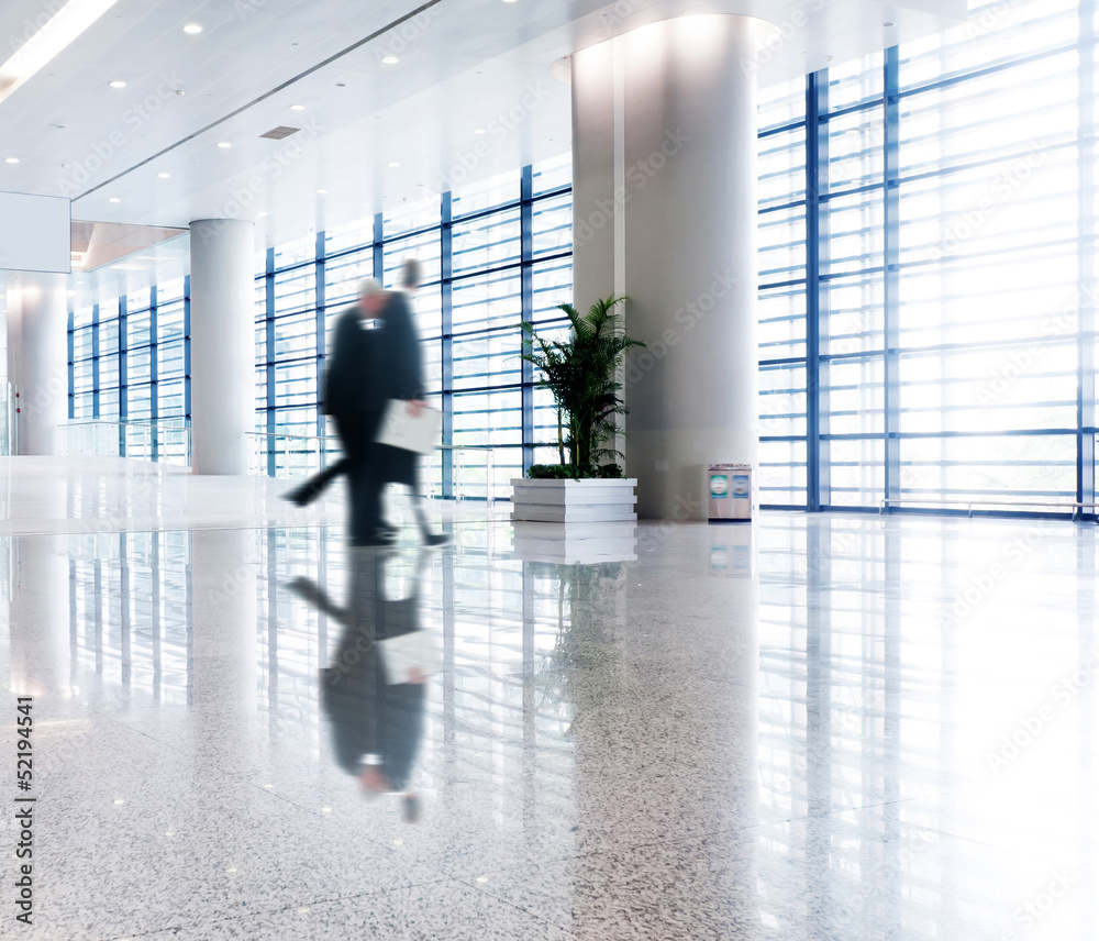 people silhouette in hall of office building