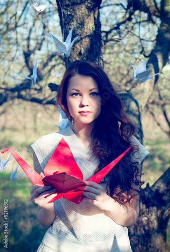 Girl with origami crane