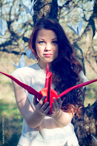 Girl with origami crane