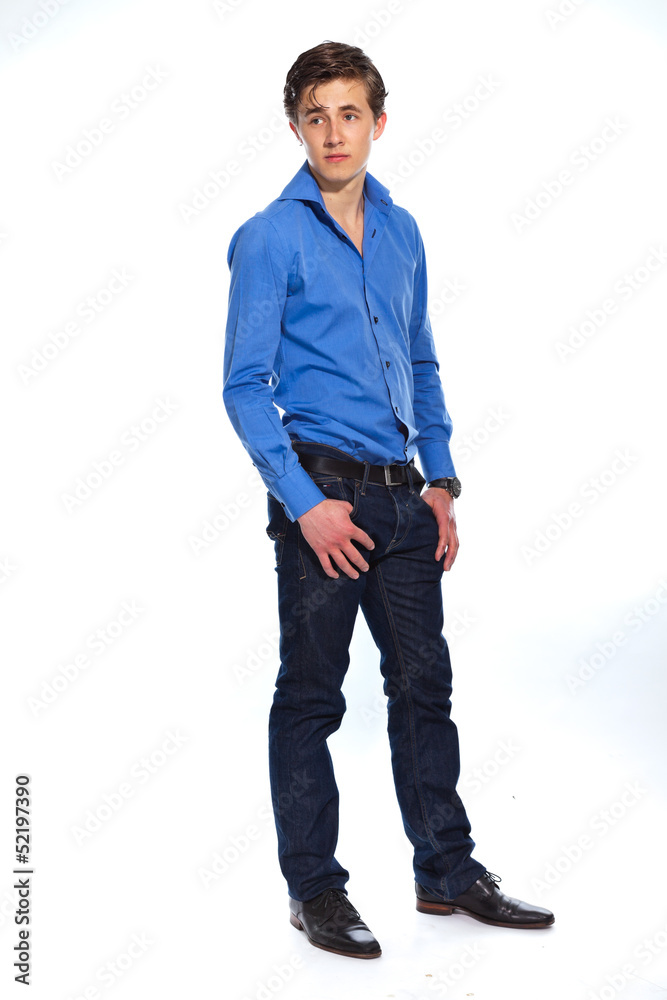 Young business man wearing blue shirt and jeans. Isolated on whi Young business man wearing blue shirt and jeans. Isolated on whi