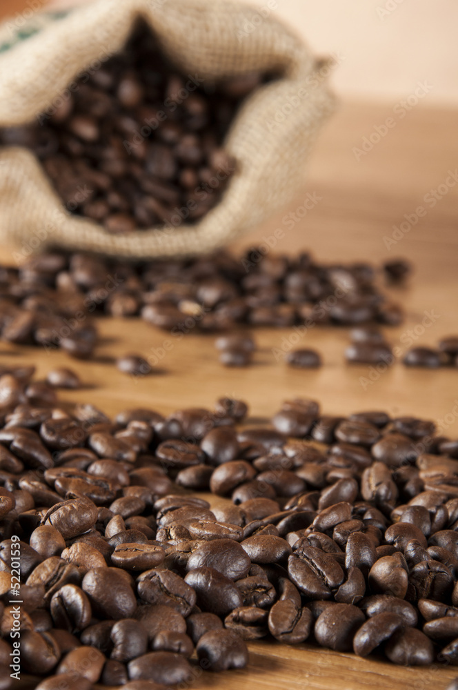 Fototapeta premium Coffee theme with wooden table and dark background