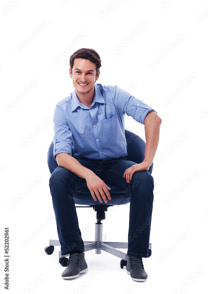 Handsome male sitting on chair