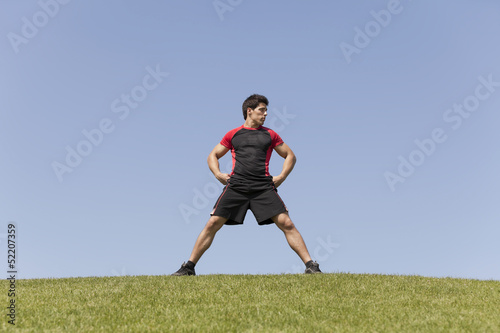 Athlete male in the grass