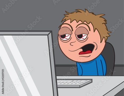 Man staring into computer with bloodshot eyes