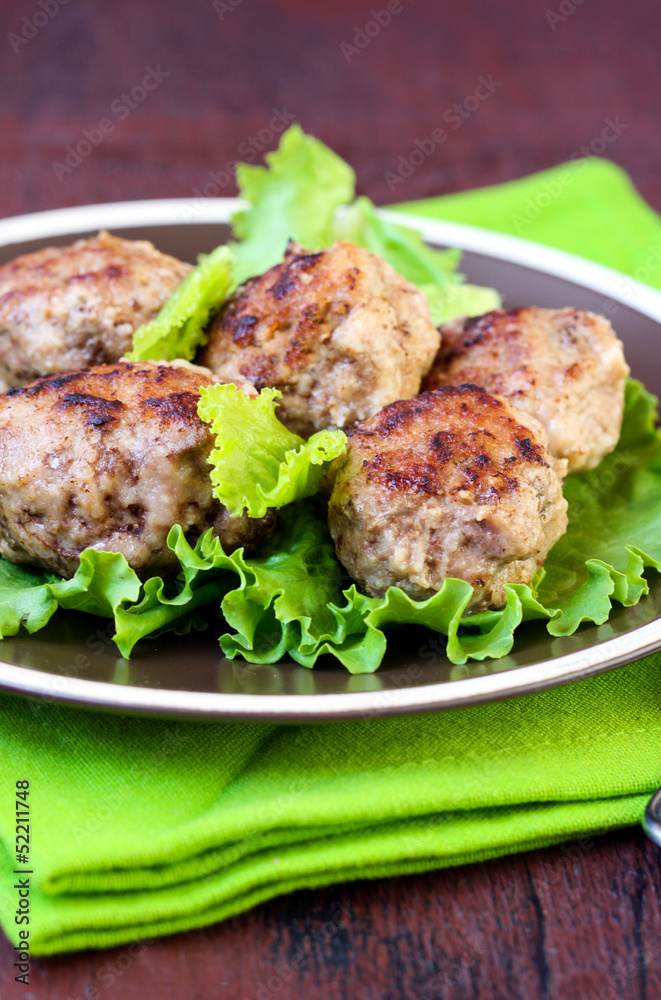 Meatballs on salad leaves