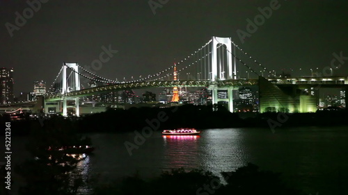 The Rainbow Bridge is a suspension bridge crossing northern Tokyo Bay. Night view with lights