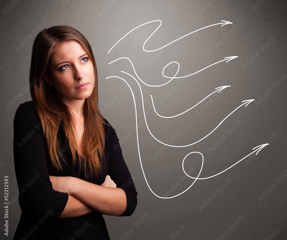 Attractive teenager looking at multiple curly arrows