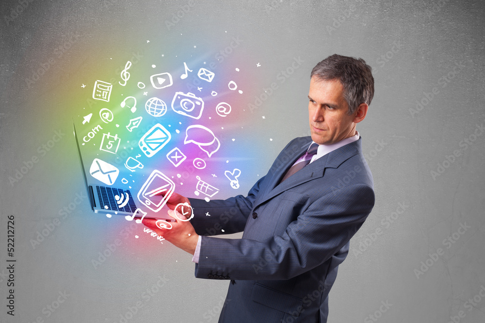 Businessman holding notebook with colorful hand drawn multimedia Businessman holding notebook with colorful hand drawn multimedia