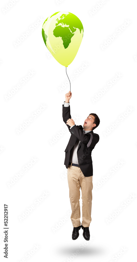 handsome man holding a green globe balloon handsome man holding a green globe balloon