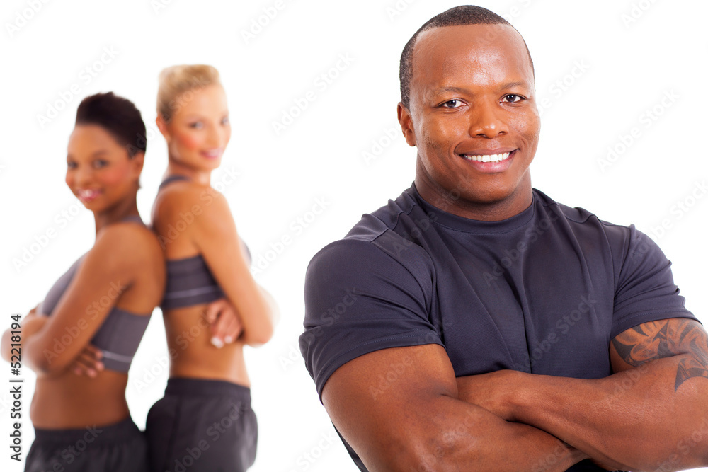 african male personal trainer and two gym members african male personal trainer and two gym members