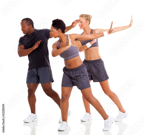 group of young adult doing fitness dance