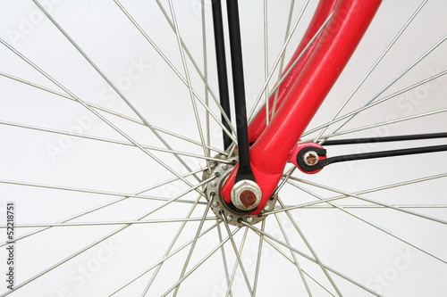 Closeup of bicycle spoke on wheel isolated on white
