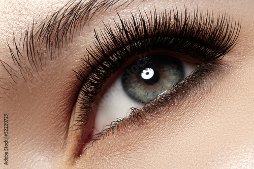 Valokuvatapetti Macro of beautiful eye with extremely long eyelashes