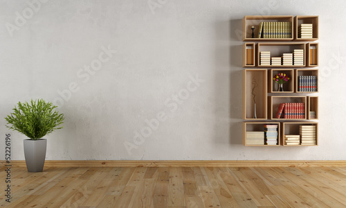 Empty interior with wall bookcase photo