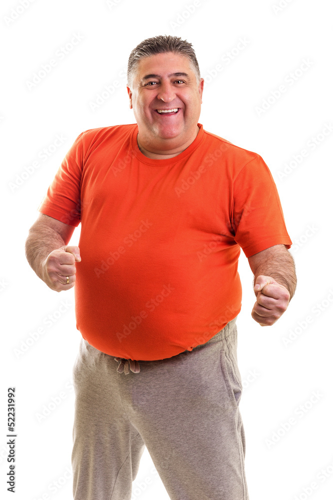 Portrait of a happy fat man posing in studio