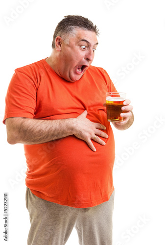 Obraz na płótnie Portrait of a thirsty fat man staring at a glass of beer w salonie