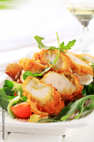 Breaded chicken breast with salad greens