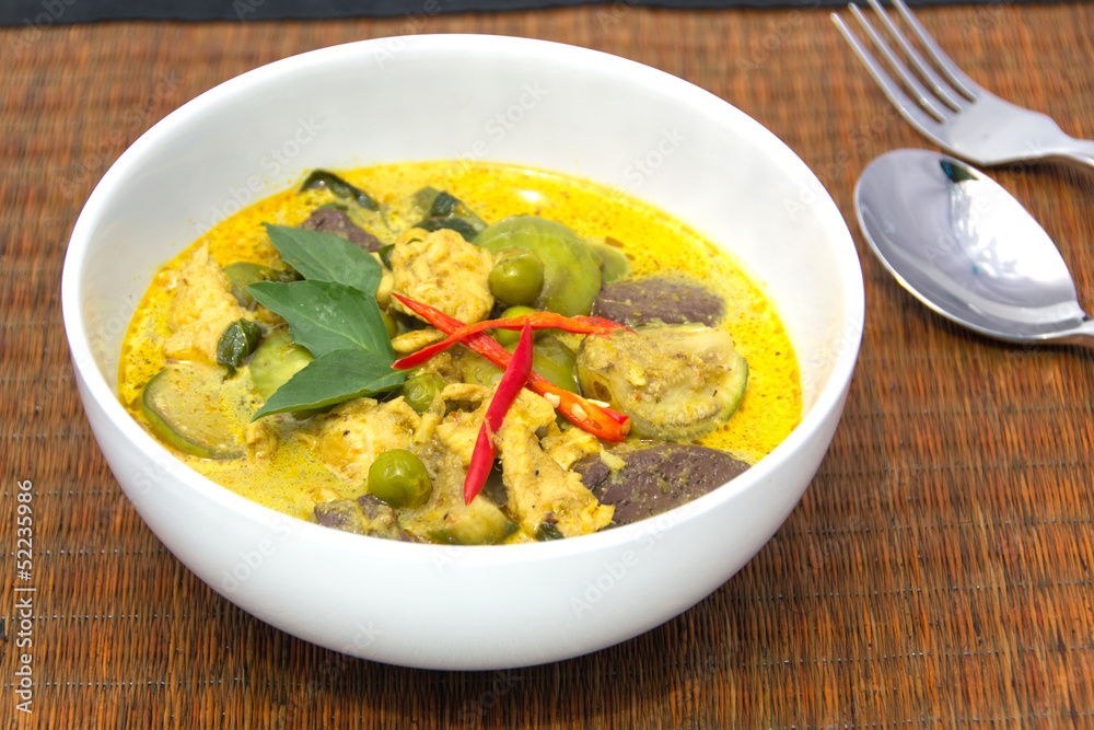 Green Curry with Chicken in a white bowl Green Curry with Chicken in a white bowl