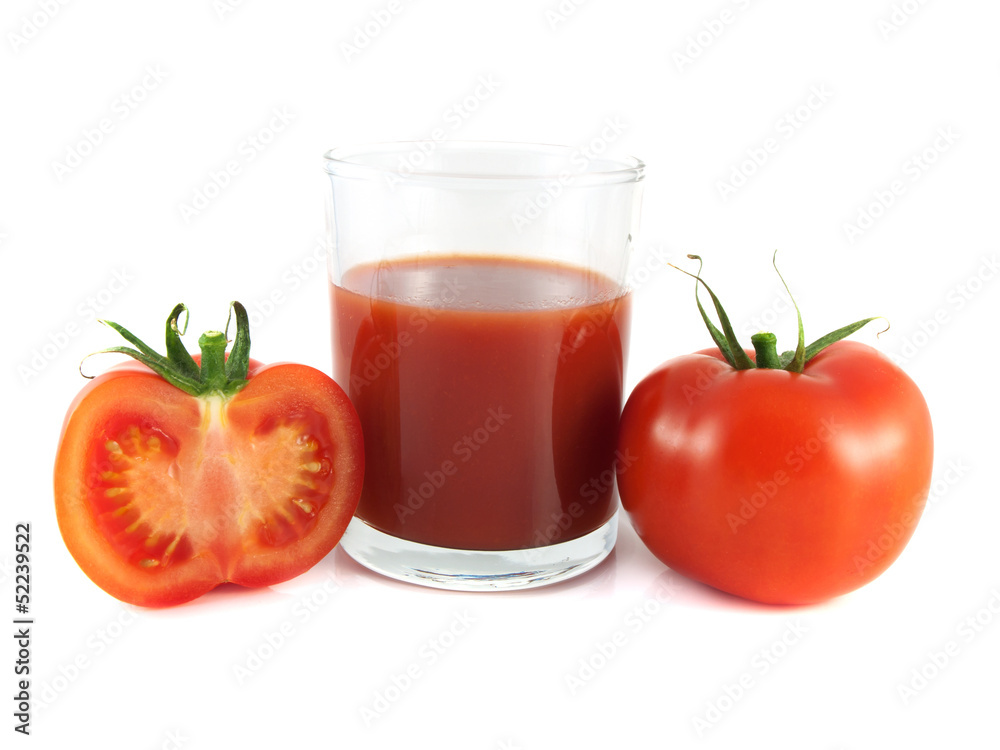 Red ripe tomato, slice with glass of tomato juice