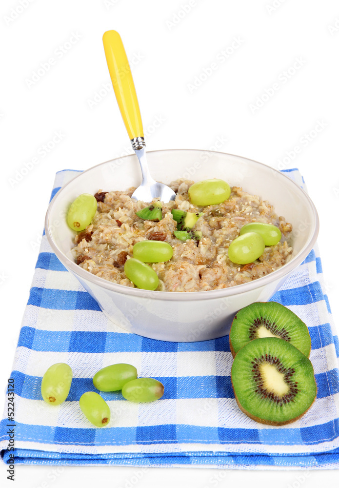 Useful oatmeal in bowl with fruit isolated on white Useful oatmeal in bowl with fruit isolated on white