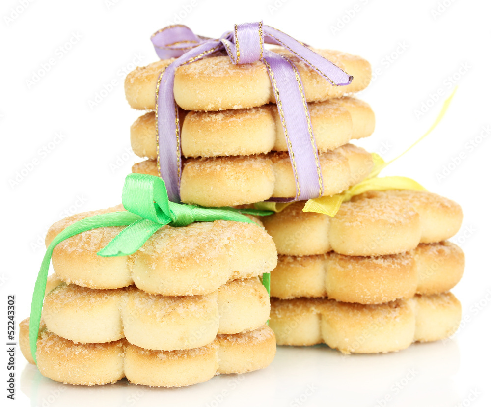 Sweet cookies tied with colorful ribbons isolated on white Sweet cookies tied with colorful ribbons isolated on white
