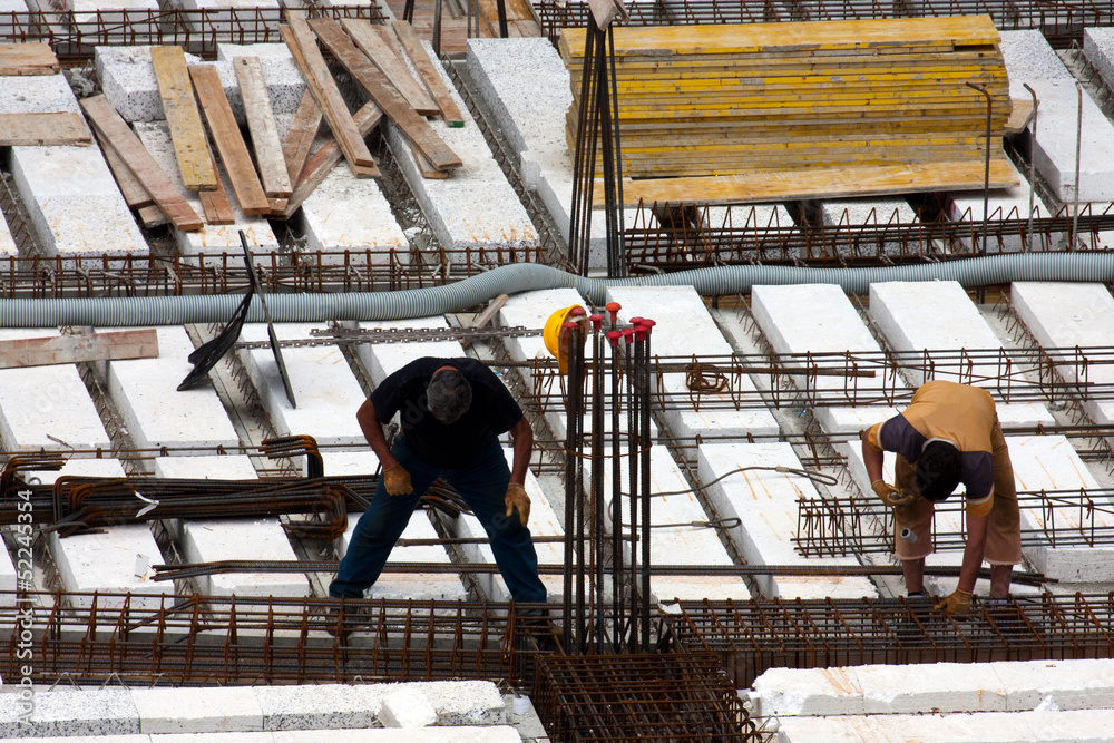 Naklejka premium Carpenters at work on a construction site