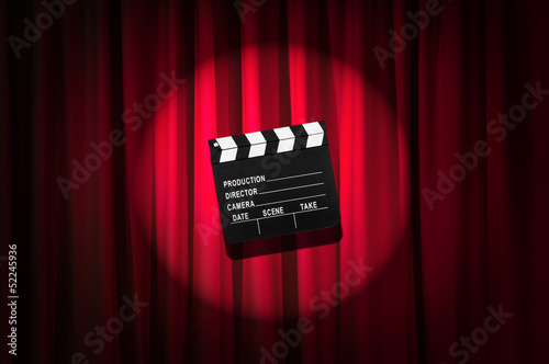 Фототапет Movie clapper board against curtain