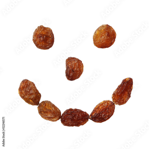 Raisins happy face isolated on white background, close up