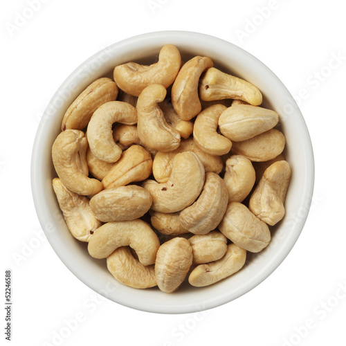 Cashew nuts in a bowl isolated on white background