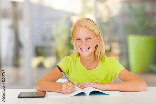 cute teen girl doing homework
