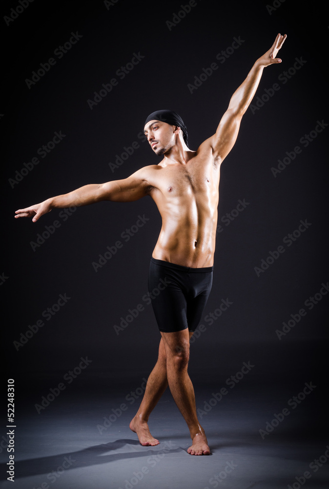 Dancer dancing in the dark studio