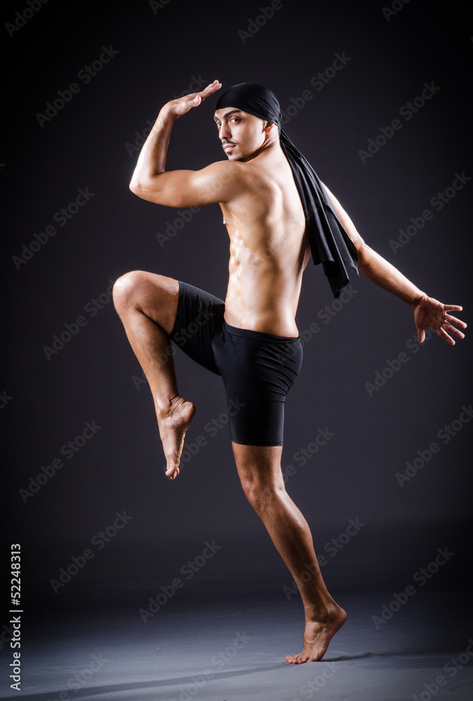 Dancer dancing in the dark studio