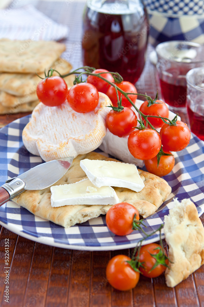 Cheese, flat bread and tomatoes Cheese, flat bread and tomatoes