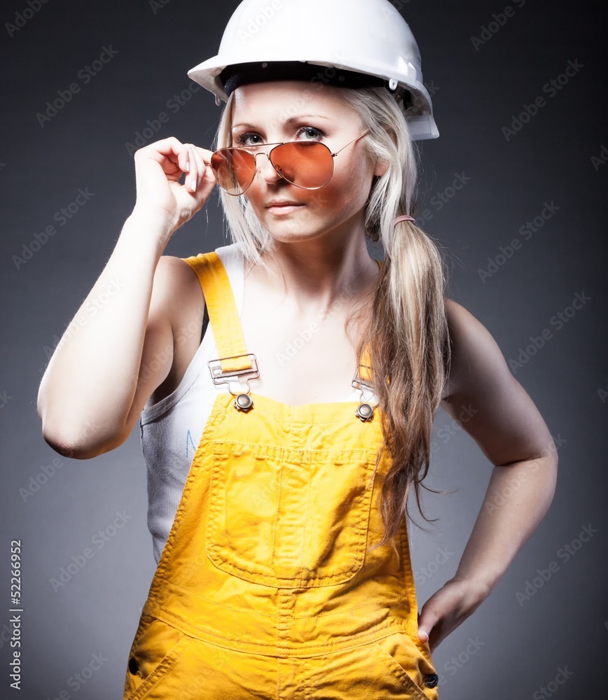 Fashionable young architect woman, construction worker Fashionable young architect woman, construction worker