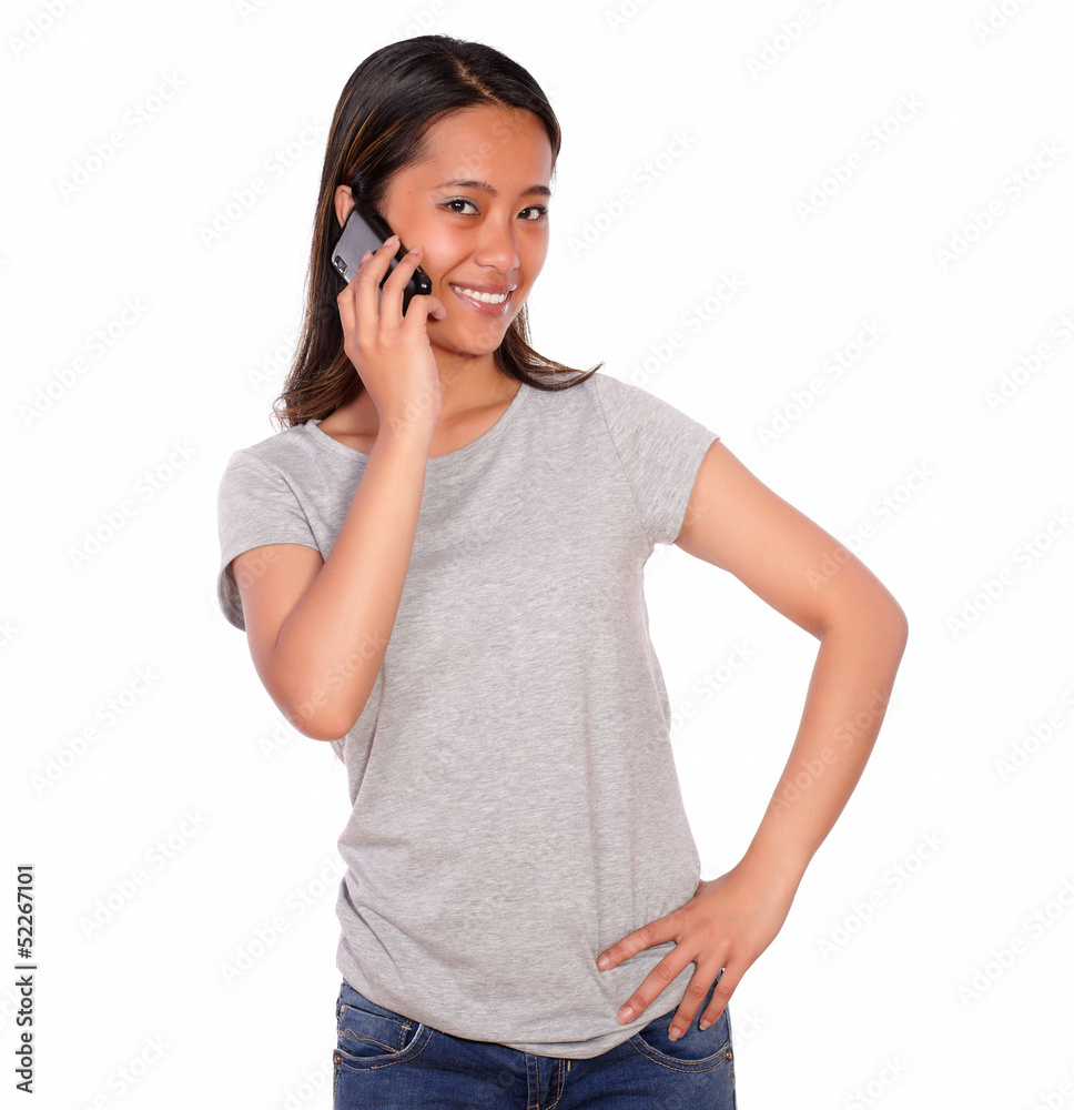 Smiling asiatic young woman speaking on cellphone Smiling asiatic young woman speaking on cellphone
