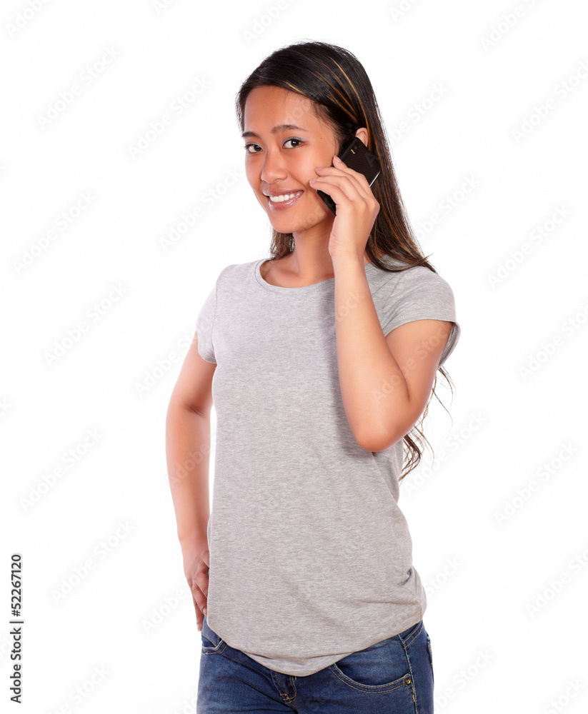 Charming asiatic young woman speaking on cellphone Charming asiatic young woman speaking on cellphone
