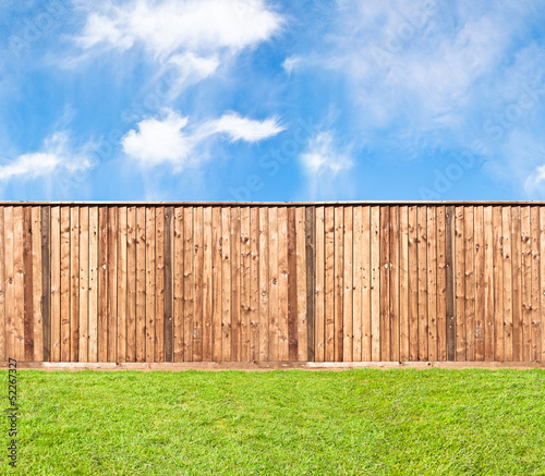 Wooden fence at the grass