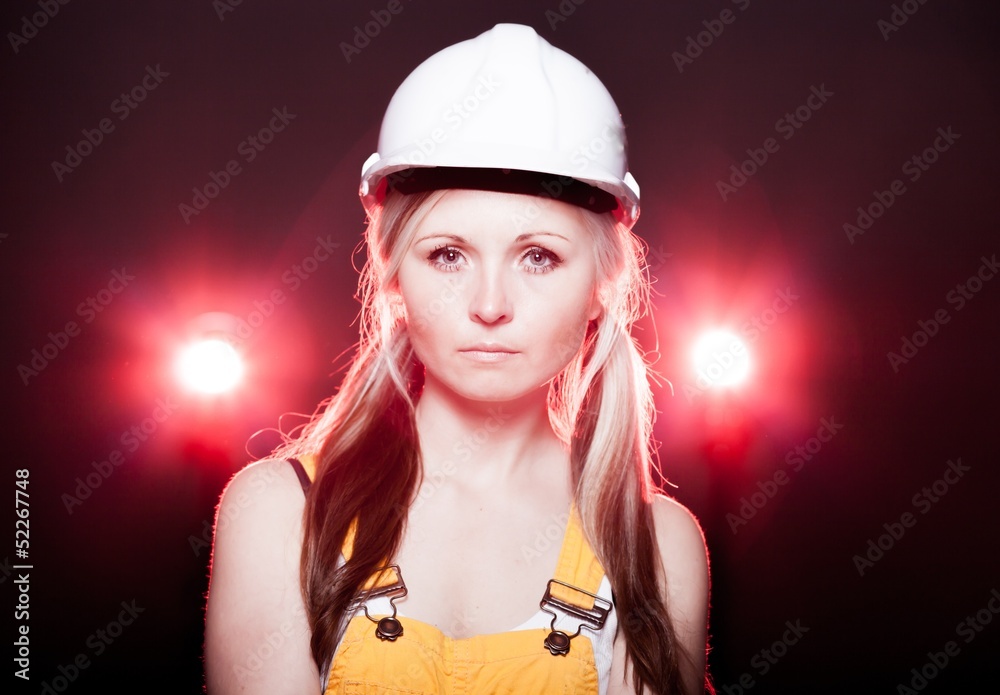 Fototapeta premium Young architect woman construction worker, glowing lights