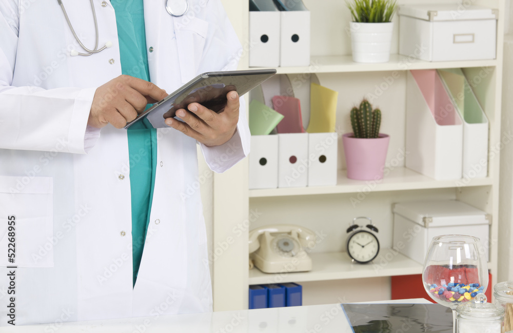 Doctor working on a digital tablet