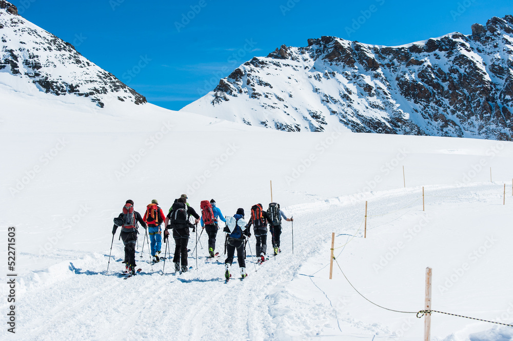 Group of Ski player walking on the snow into the mountain