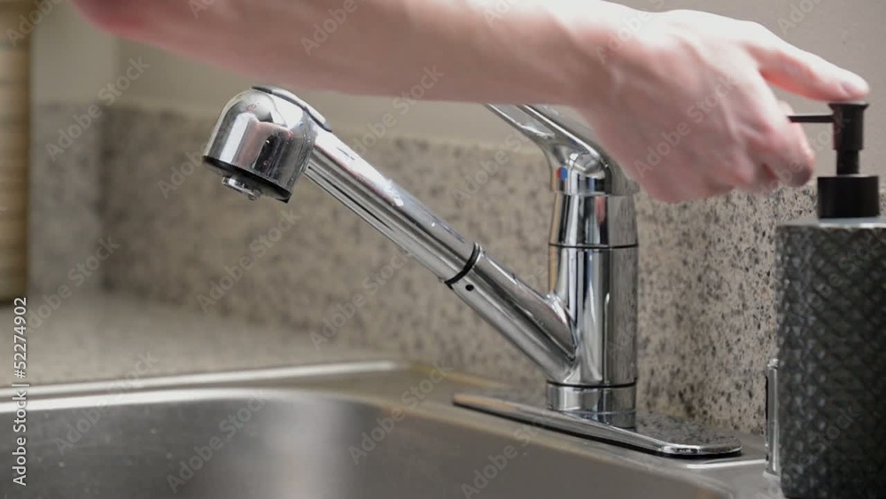 Close up man washing hands kitchen sink, slow motion, overcrank Close up man washing hands kitchen sink, slow motion, overcrank