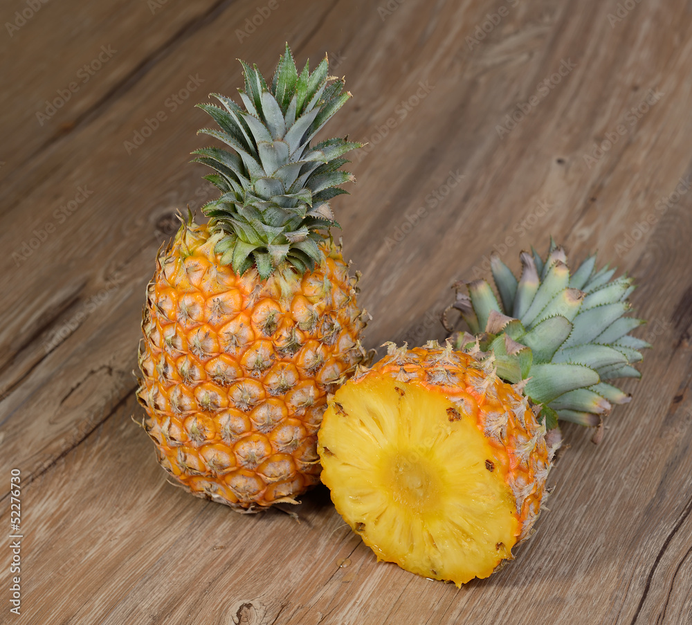 two Pineapples on wooden grunge background two Pineapples on wooden grunge background