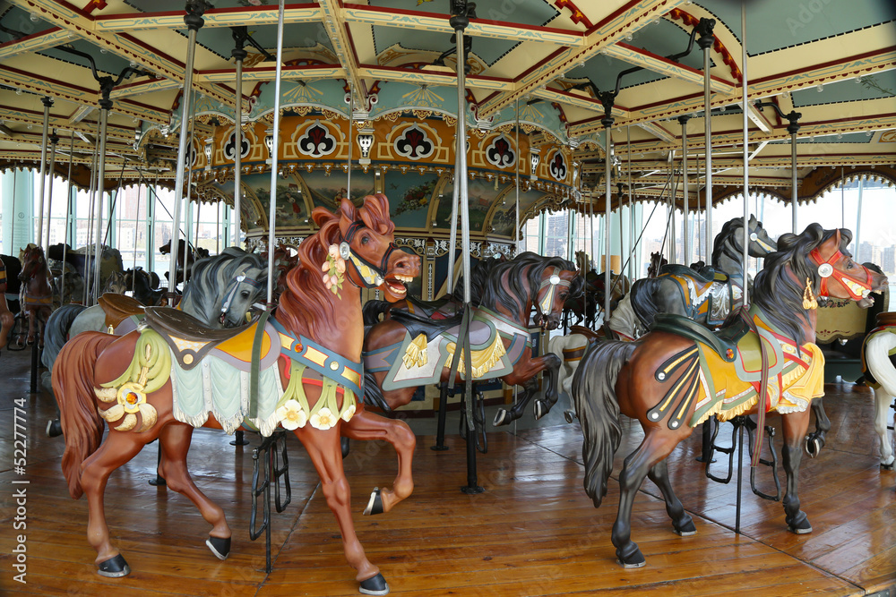 Horses on a traditional fairground carousel