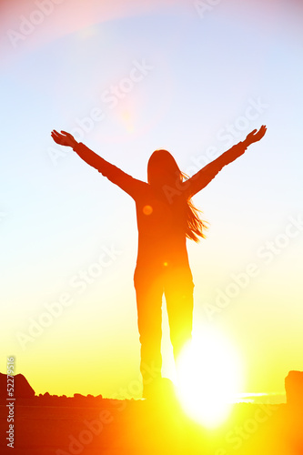 Happy cheering celebrating success woman sunset