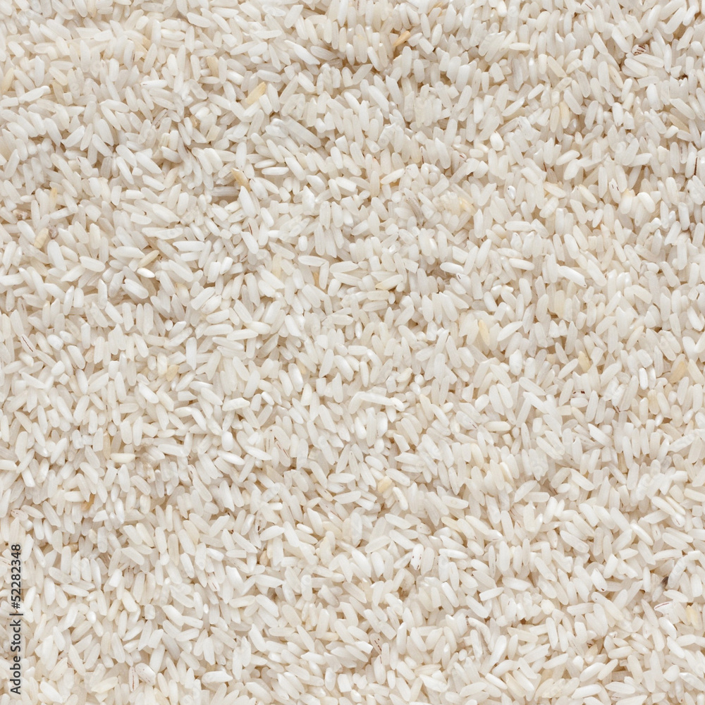 White long rice background, uncooked raw cereals White long rice background, uncooked raw cereals