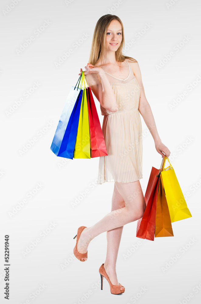 Young woman with colorful shopping bags