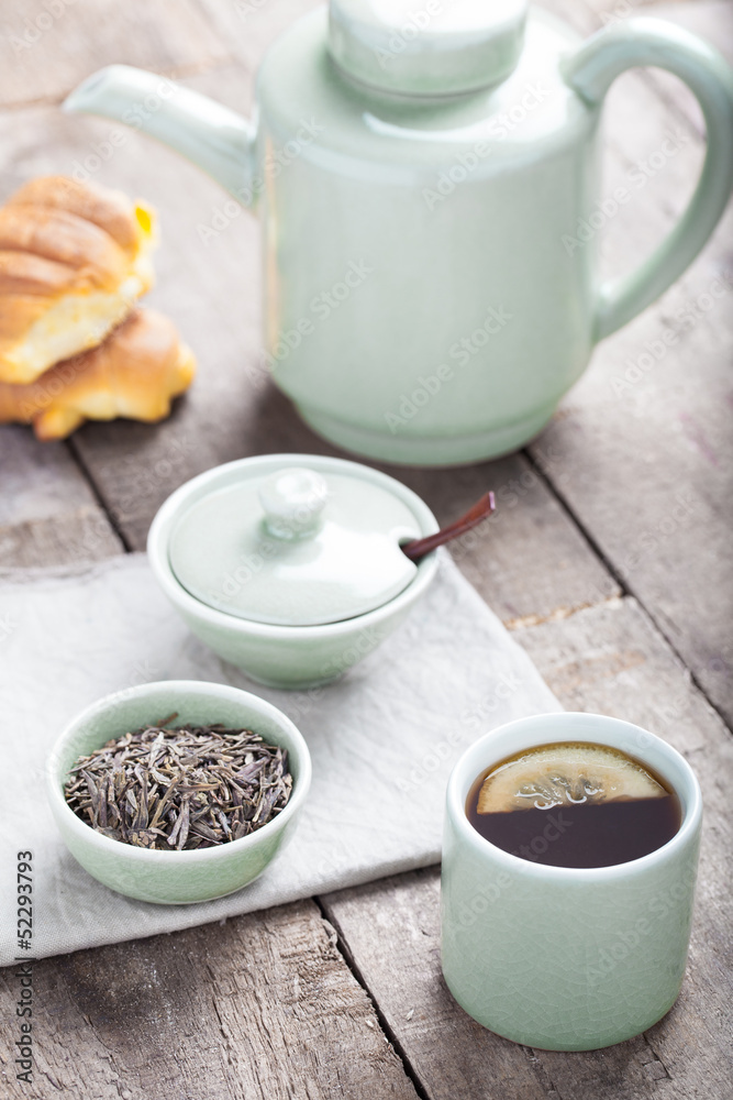 Tea set with tea crop, croissants, teapot and mug. Tea set with tea crop, croissants, teapot and mug.
