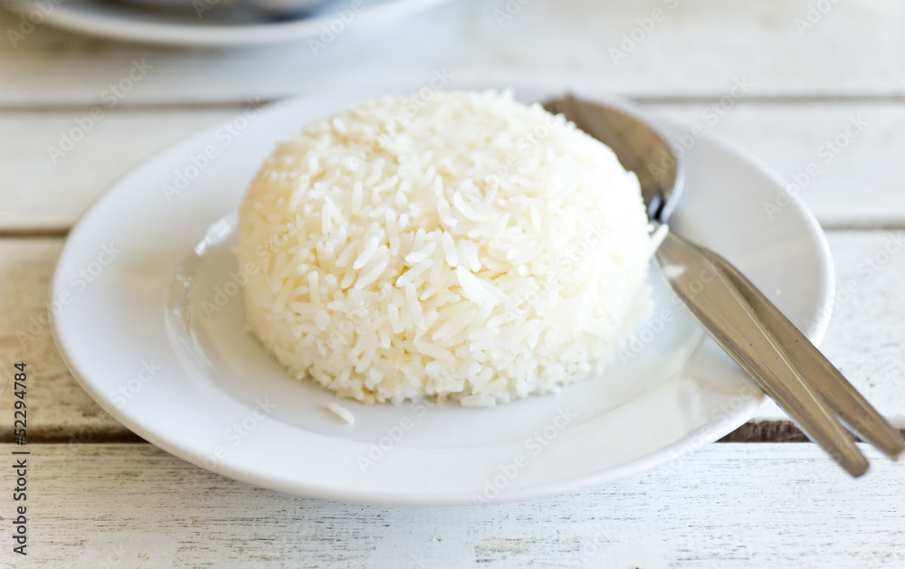 Thai jasmine cooked rice on white plate Thai jasmine cooked rice on white plate